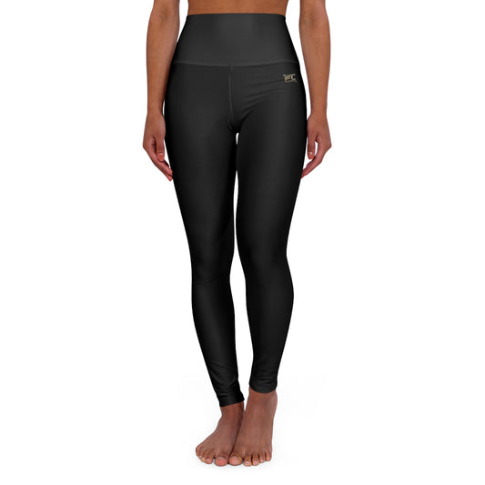 Legging taille haute pour femme, conçu en tissu respirant et extensible, offrant confort et maintien pour la musculation et le sport