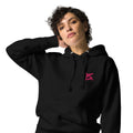 FL-FIT Hoodie — femme, noir, gros plan face avant, détail logo FL rose brodé poitrine gauche, cordons capuche blanc cassé, œillets métal