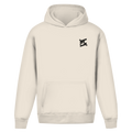 Sweat à capuche beige oversize vu de face, design épuré et ample avec un petit logo noir contrastant sur la poitrine.